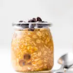 a jar of overnight oats topped with chocolate chips