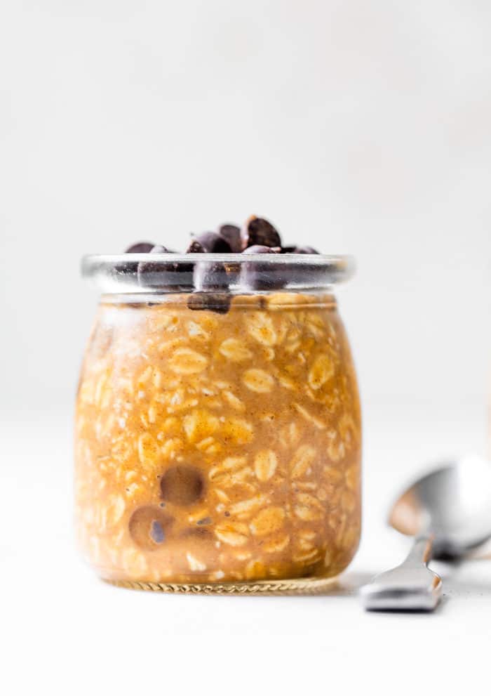 a jar of overnight oats topped with chocolate chips