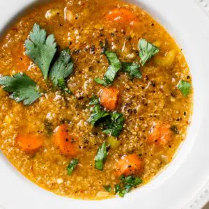 a bowl of vegetable soup with quinoa