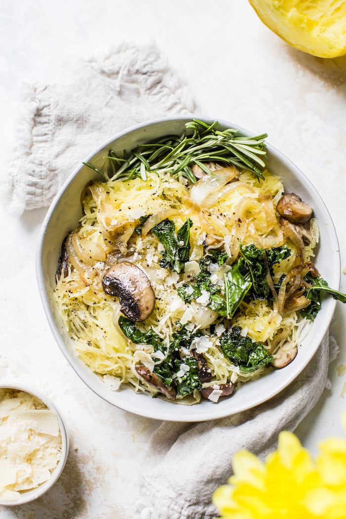 Caramelized Onion Spaghetti Squash | squash filled with onions, mushrooms and kale for a healthy, vegetarian meal | thealmondeater.com