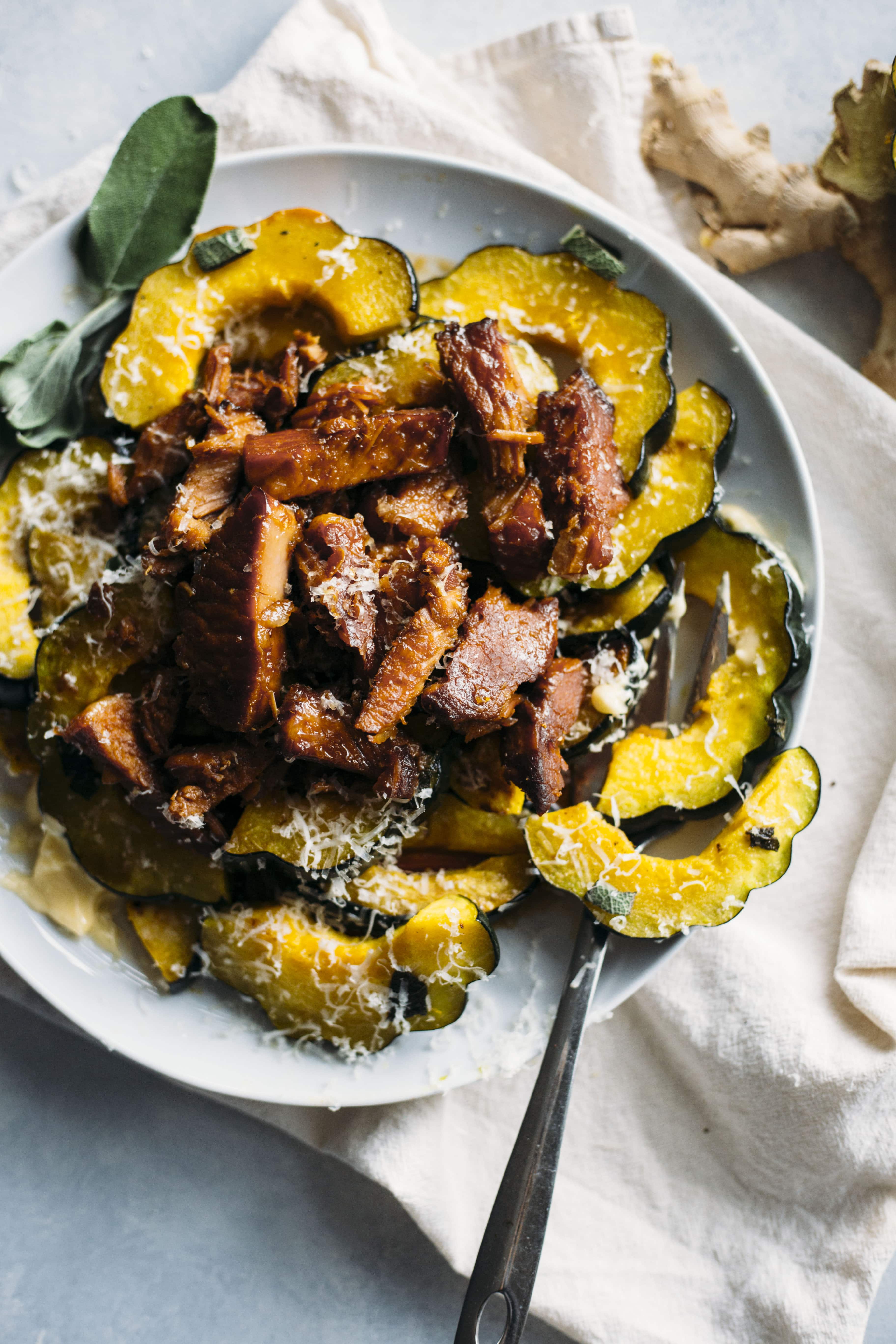 Roasted Acorn Squash | Acorn squash topped with honey ginger pork made in the slow cooker. A tasty way to enjoy squash! | thealmondeater.com
