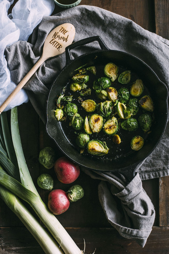 Brussels Sprouts Salad with roasted red potatoes, goat cheese and leek dressing | thealmondeater.com