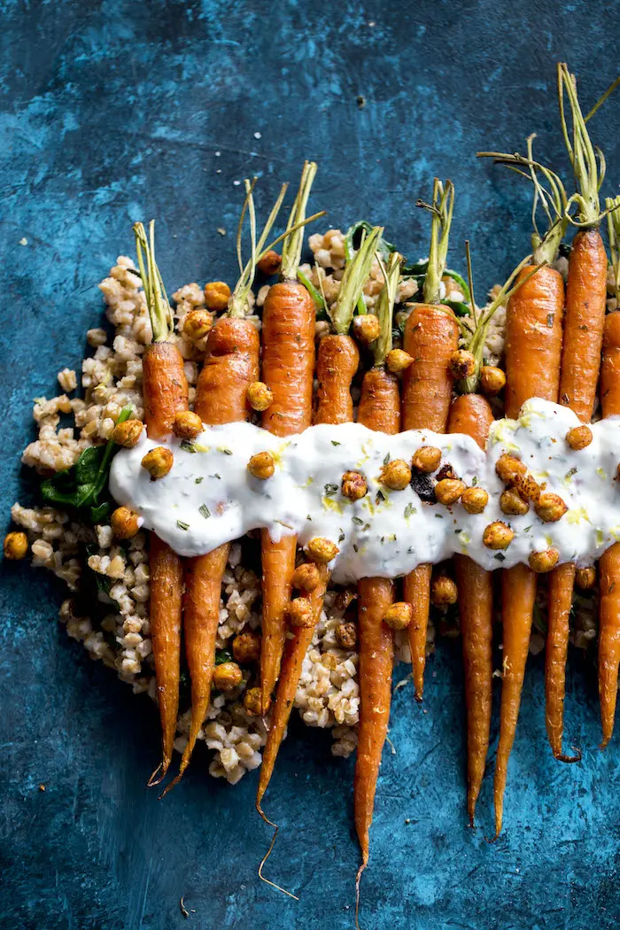 Roasted Carrots with farro, crunchy roasted chickpeas and a tangy lemon yogurt sauce!