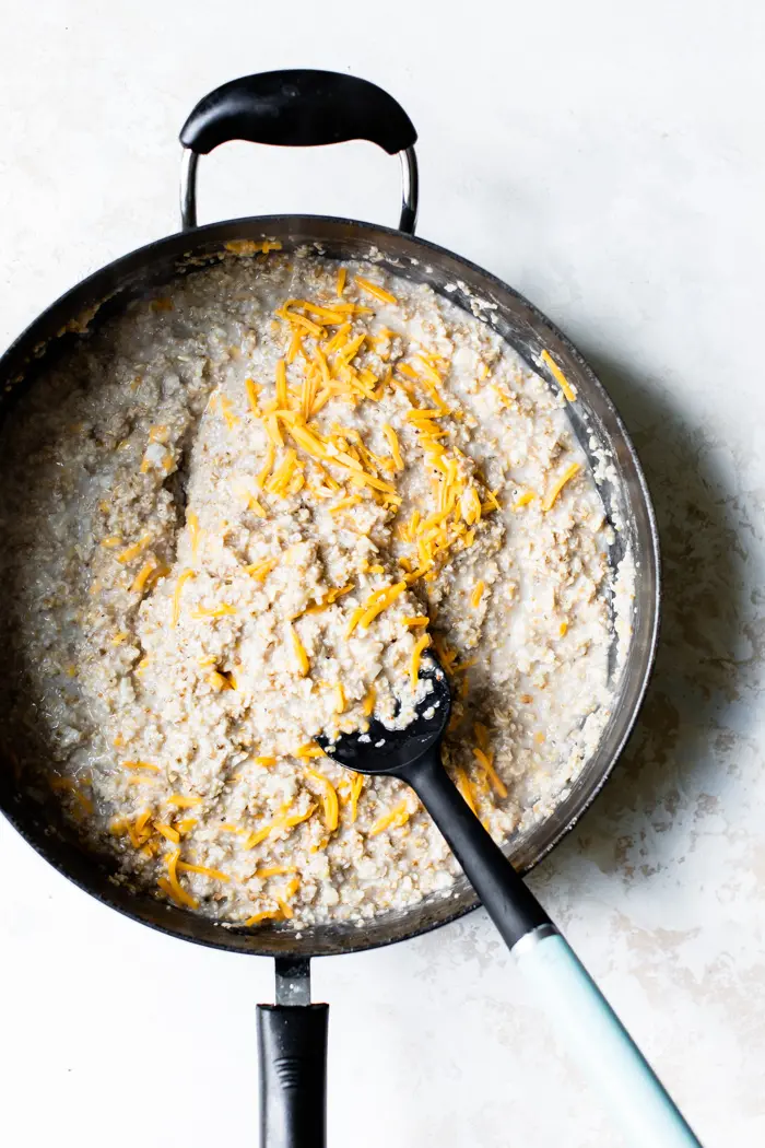 cheesy oatmeal in a large skillet