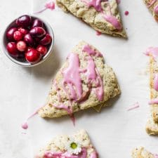 Apple Cranberry Scones - vegan-friendly scones filled with apples and topped with a sweet cranberry glaze | thealmondeater.com