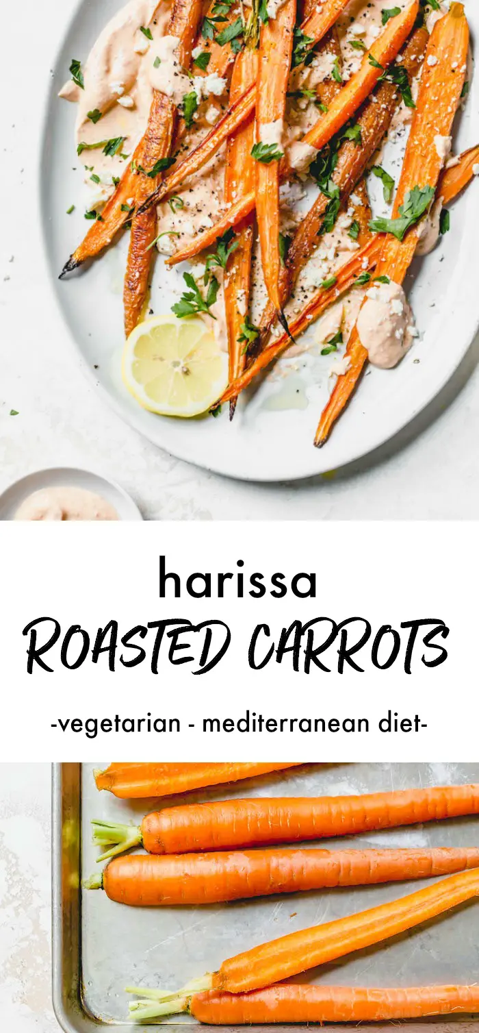 Roasted carrots on a plate with yogurt and fresh herbs.