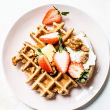 Fluffy Whole Wheat Waffles that are made with whole wheat flour, coconut oil and maple syrup for a healthier breakfast option | thealmondeater.com