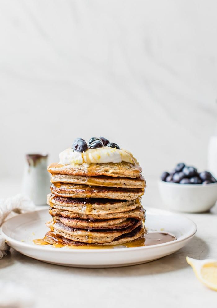 fluffy chia seed pancakes topped with lemon zest and blueberries | thealmondeater.com