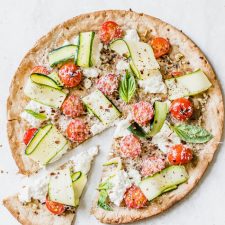 Weeknight Veggie Pizza loaded with cheese and vegetables | thealmondeater.com