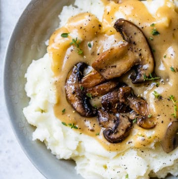 mushroom gravy on top of mashed potatoes