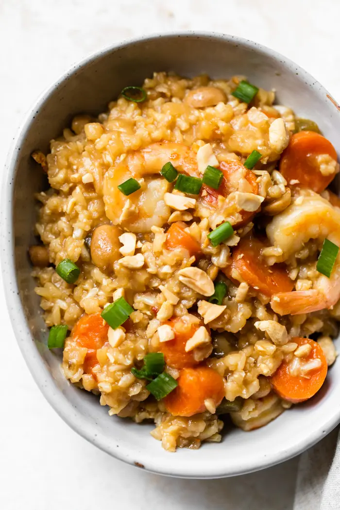 stir fry in a bowl made with rice and shrimp