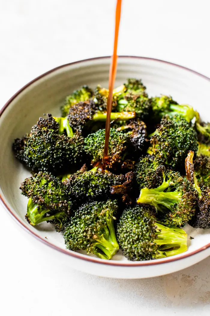 broccoli in a bowl with marinade