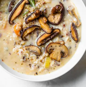 soup in a bowl topped with mushrooms