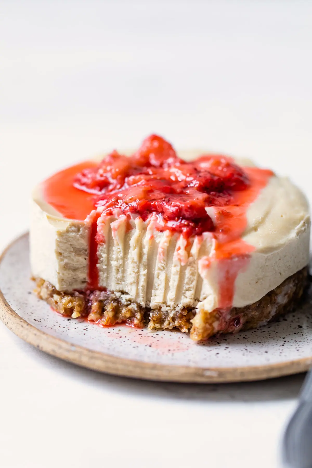 vegan cheesecake topped with strawberries