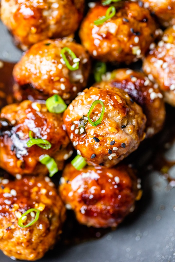 close up of meatballs with a sticky sauce