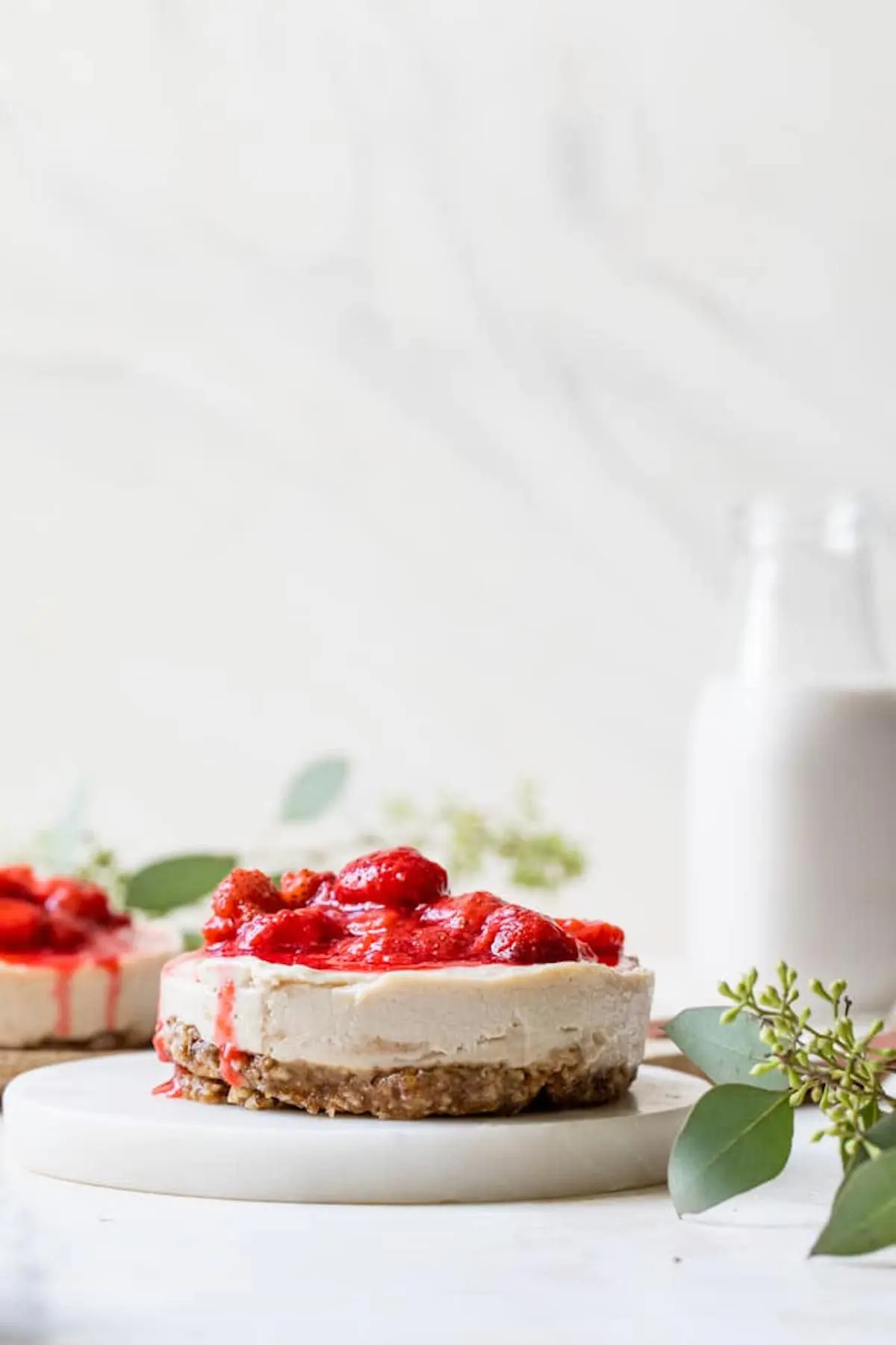 cashew cheesecake topped with strawberries