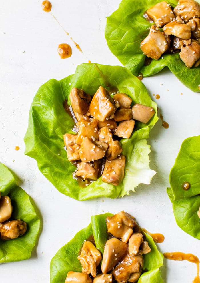lettuce topped with marinated chicken