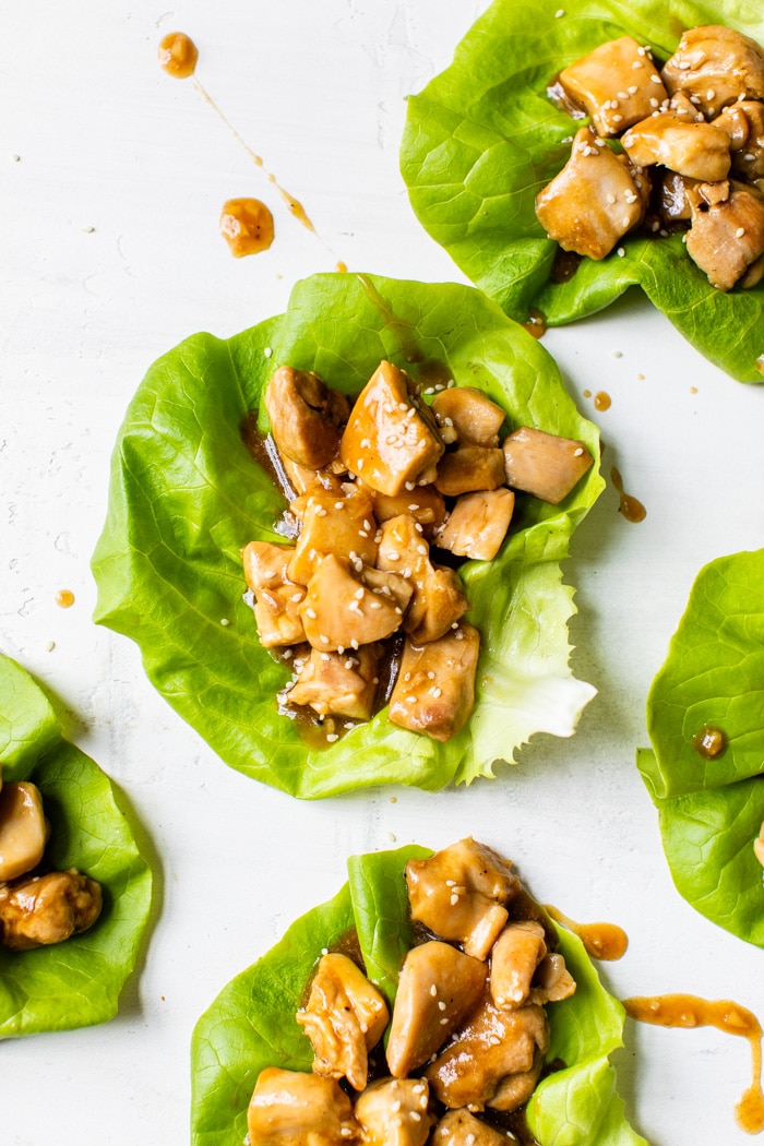 lettuce topped with marinated chicken