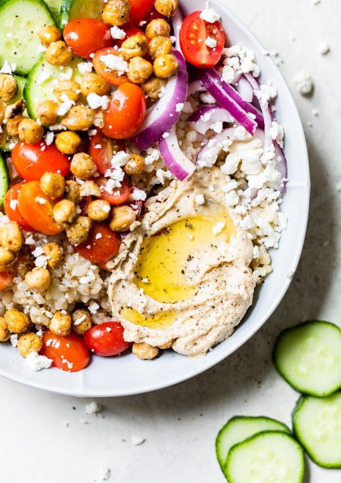 bowl with rice, vegetables and hummus