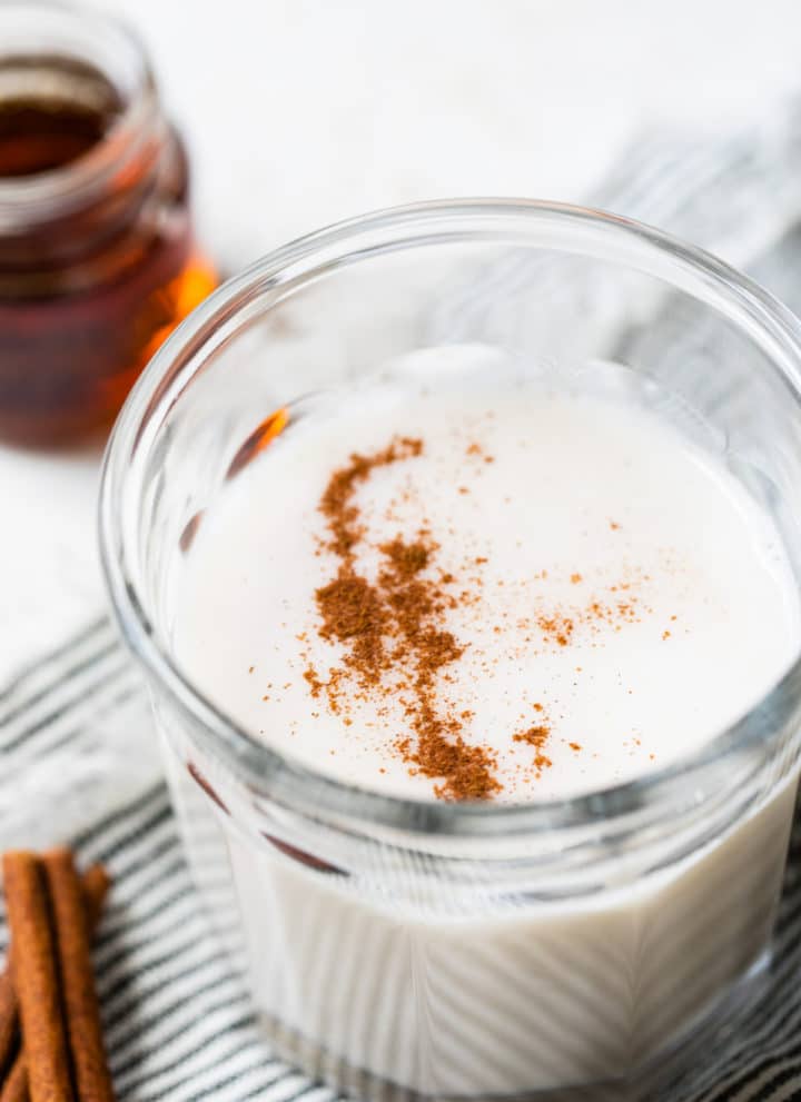 glass of milk topped with cinnamon