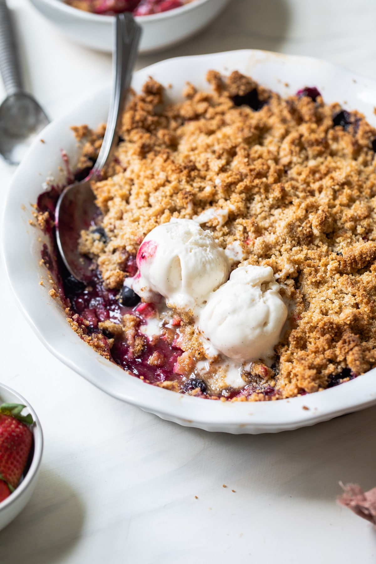 berries and ice cream in a pie pan