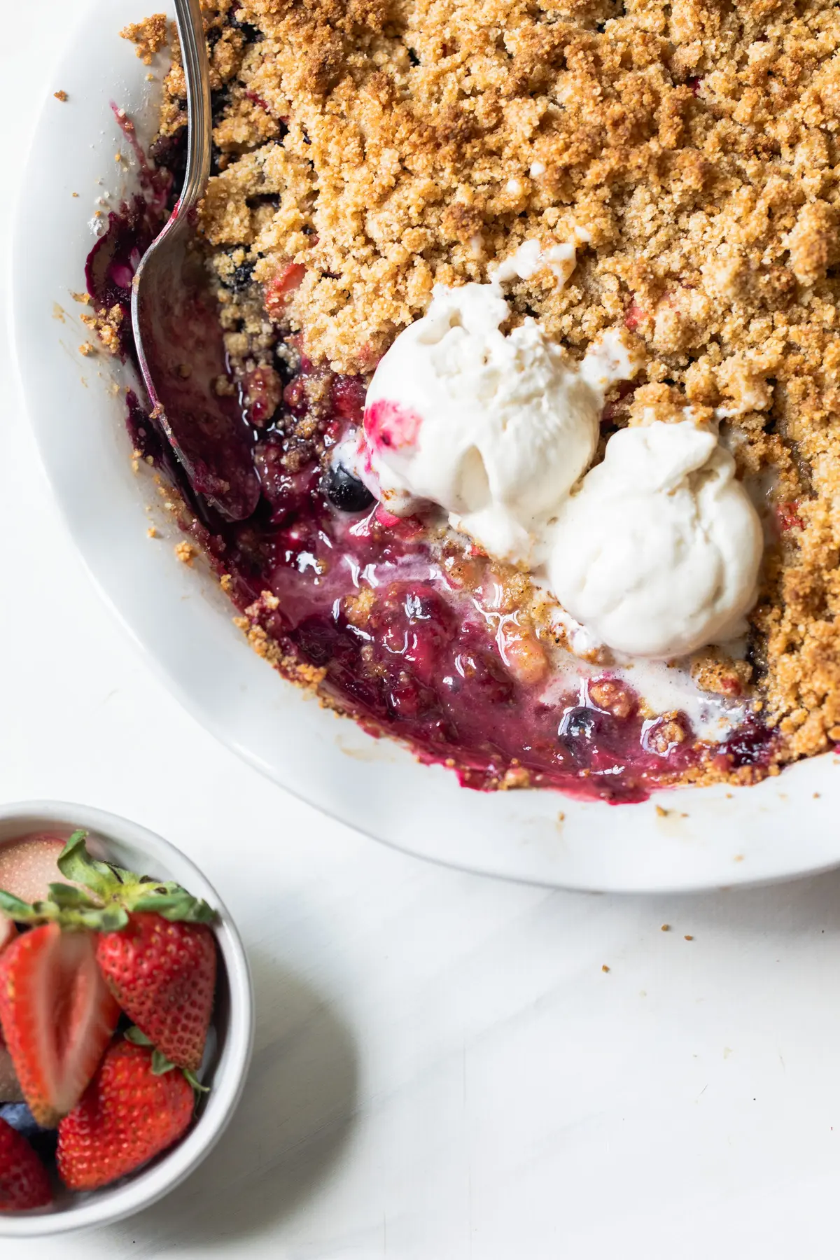 berries and ice cream in a pie pan