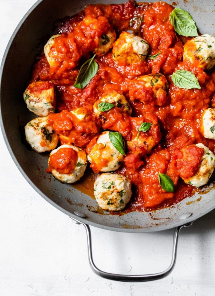 meatballs in a skillet with marinara sauce