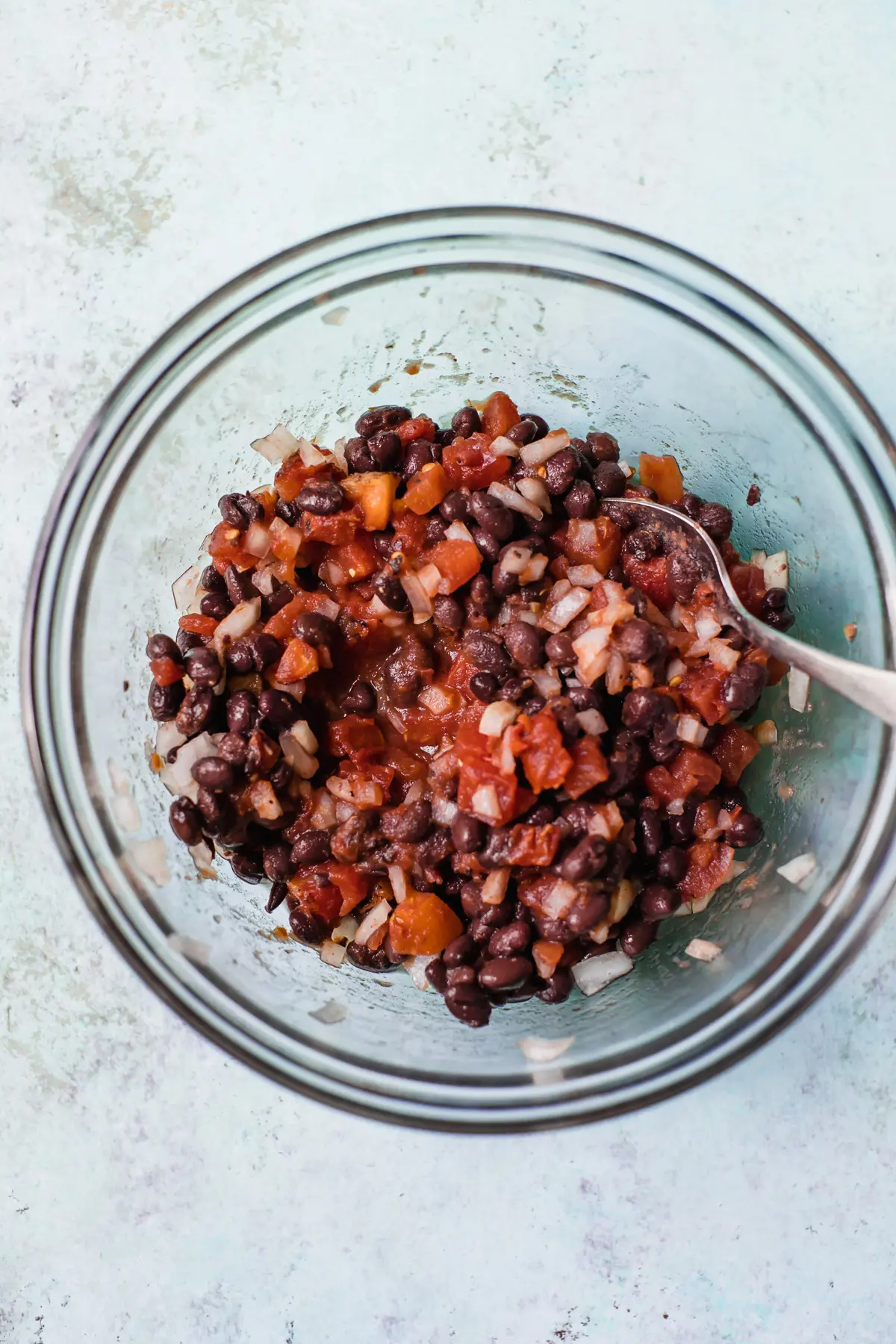 bowl of tomatoes, black beans and onion