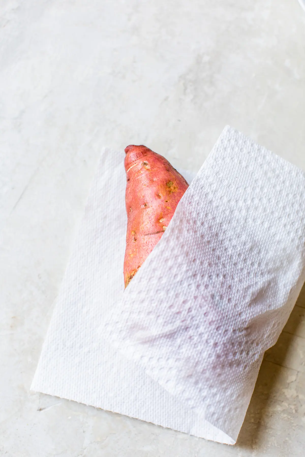 sweet potato in a paper towel