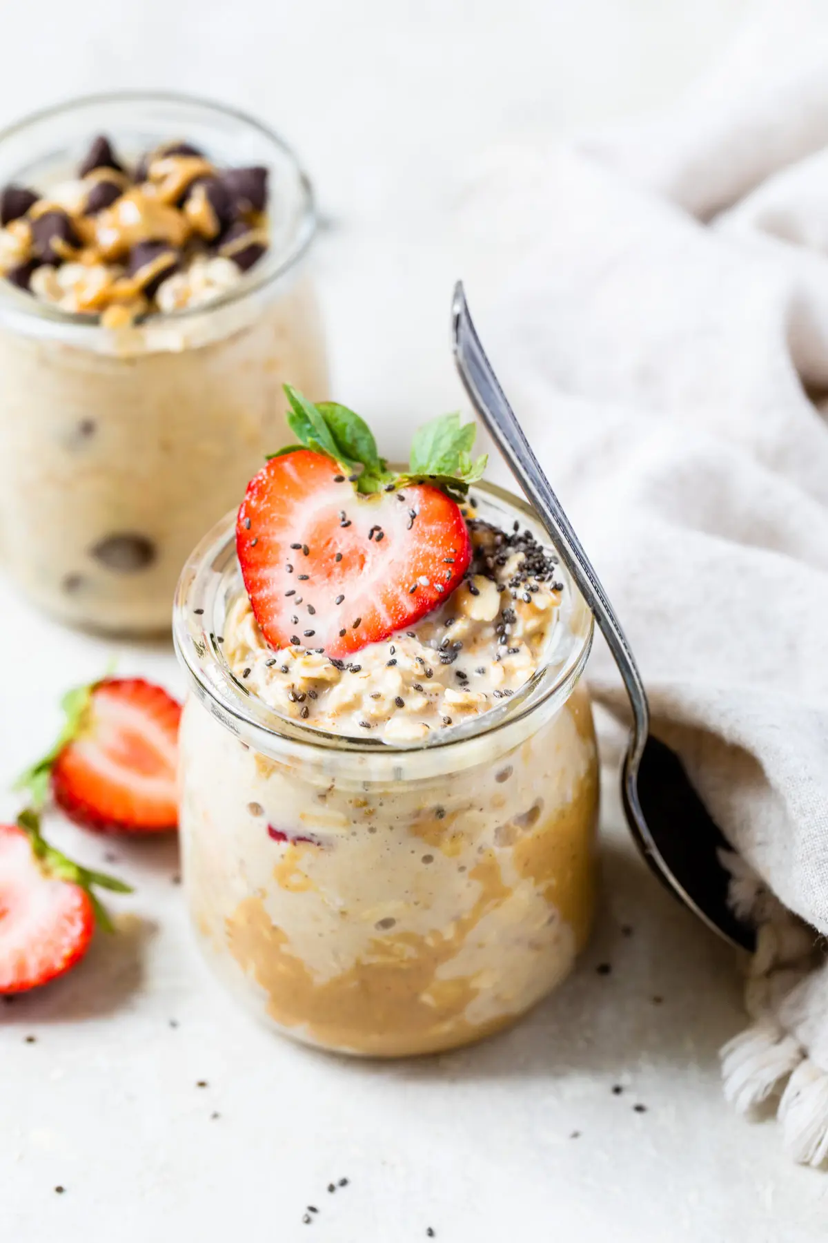 jar of oats with peanut butter and strawberries