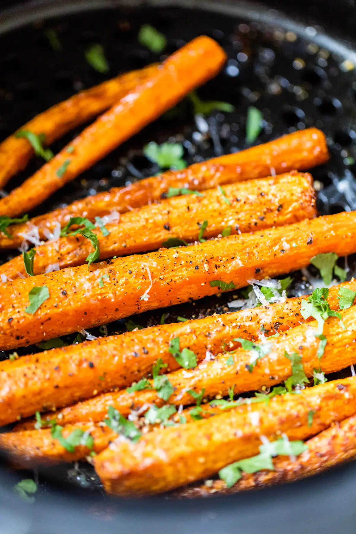 carrots topped with parmesan cheese and parsley