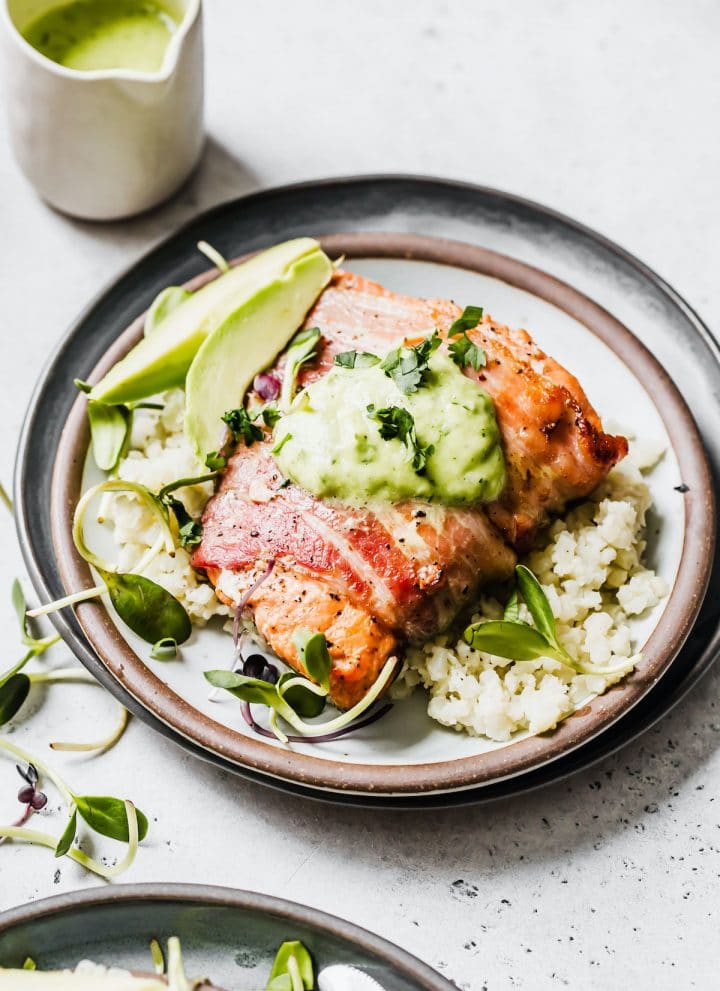 salmon on a plate with cauliflower rice