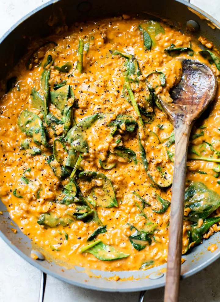 farro, spinach and sweet potato in a skillet