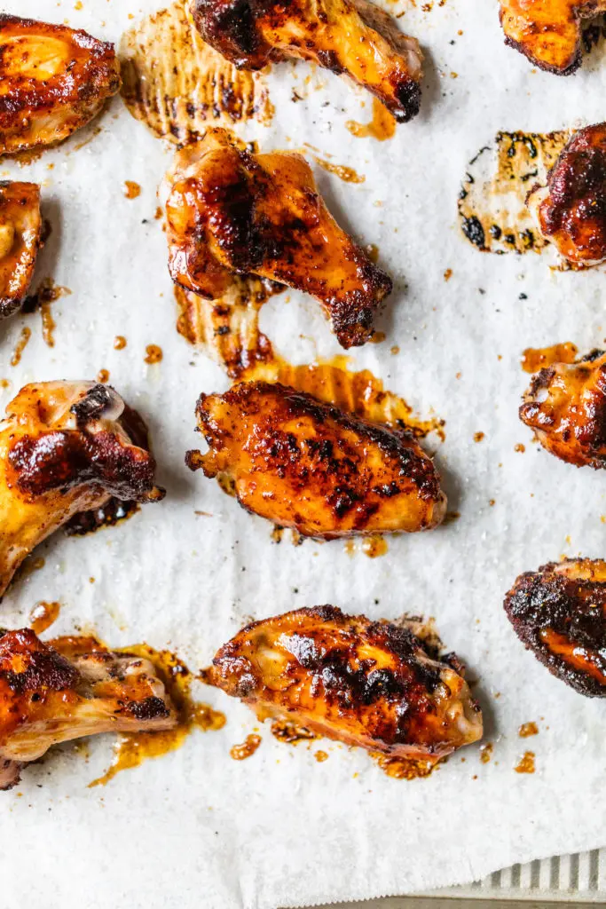 baked chicken wings on parchment paper