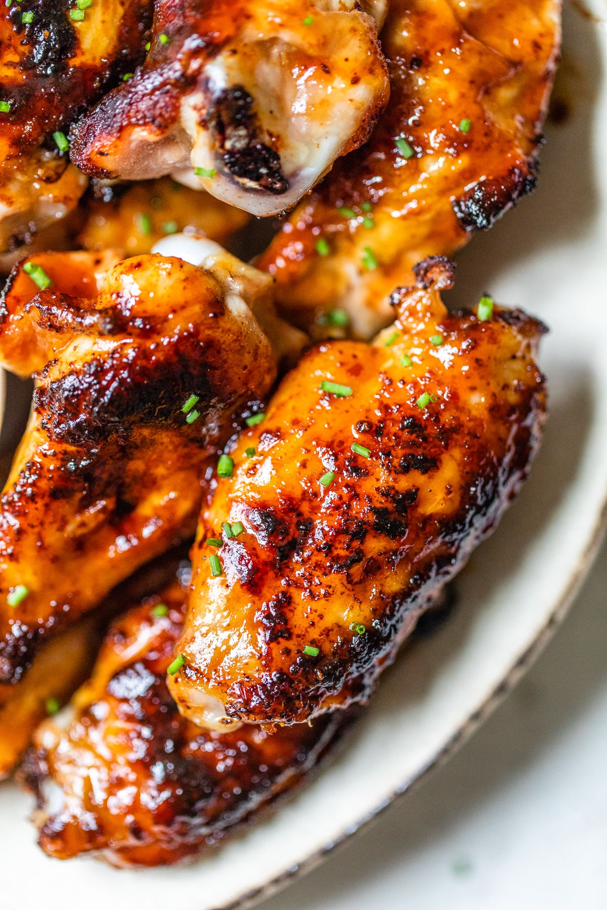 close up photo of a bbq marinated chicken wing