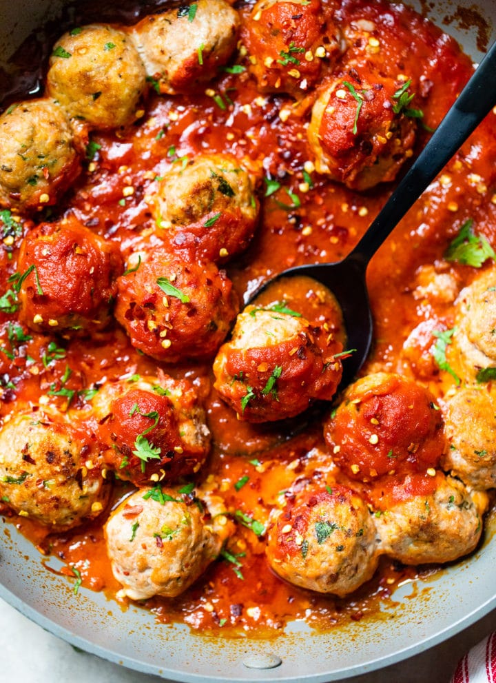 meatballs in a skillet with pasta sauce