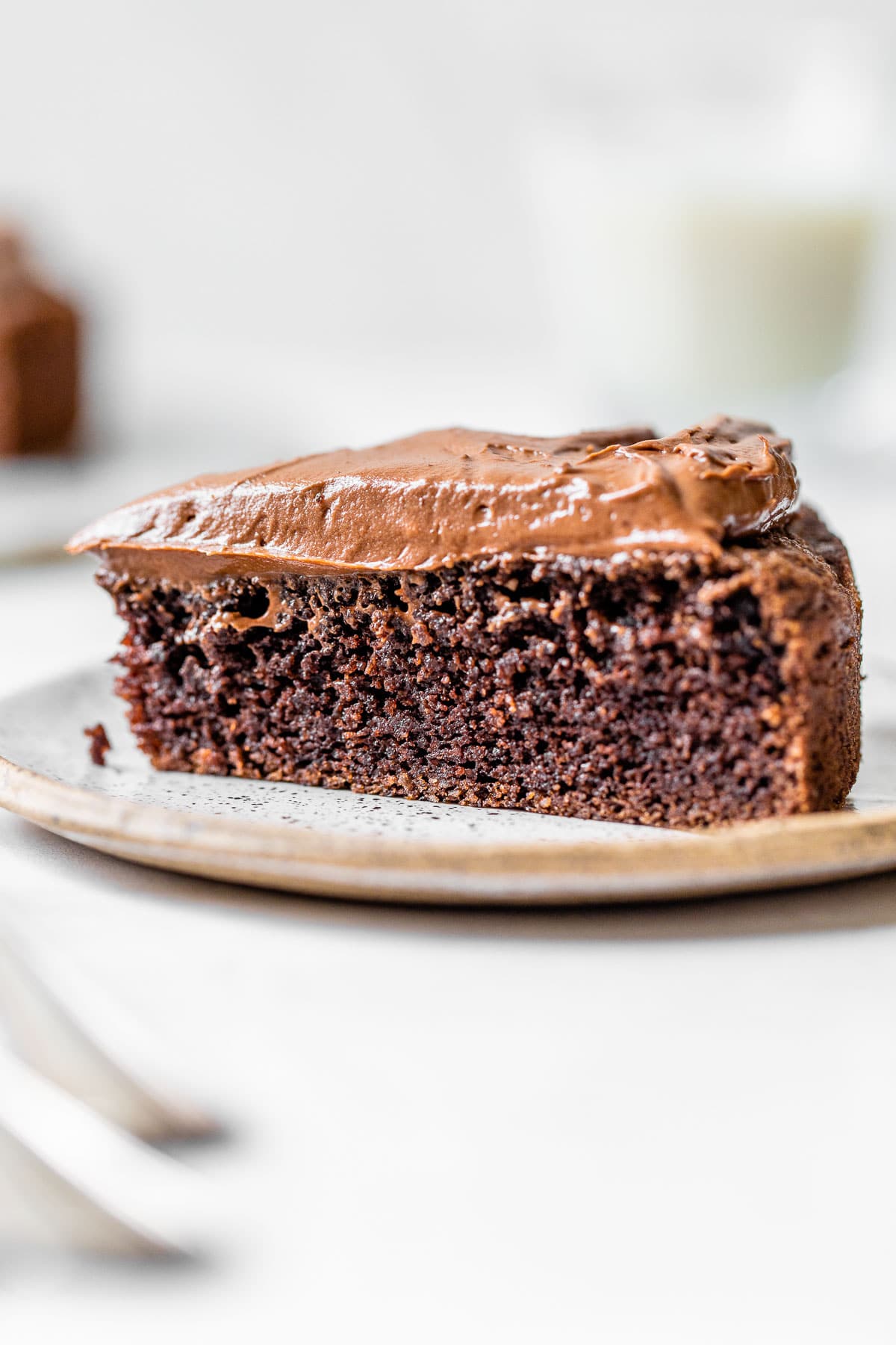 a slice of chocolate cake on a small plate