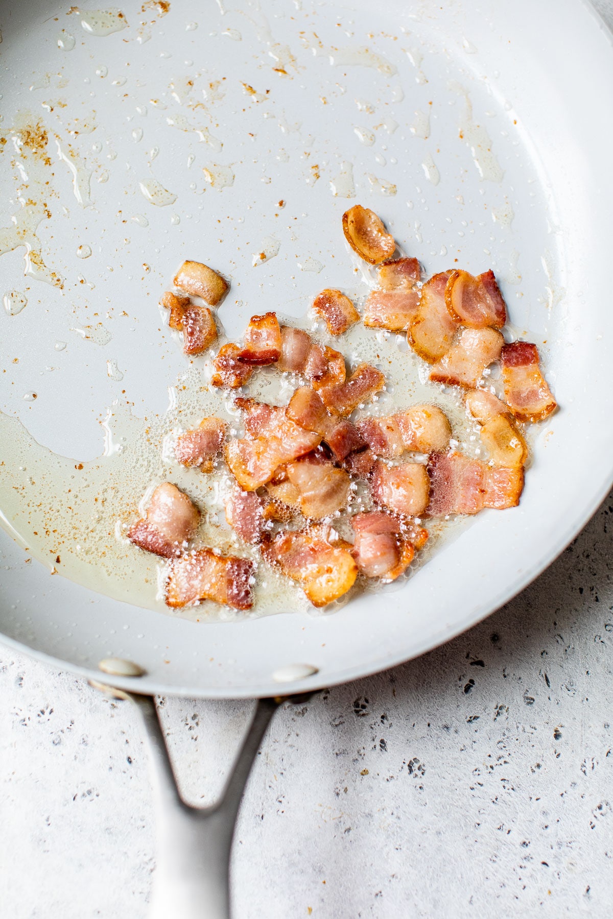 diced bacon in a skillet