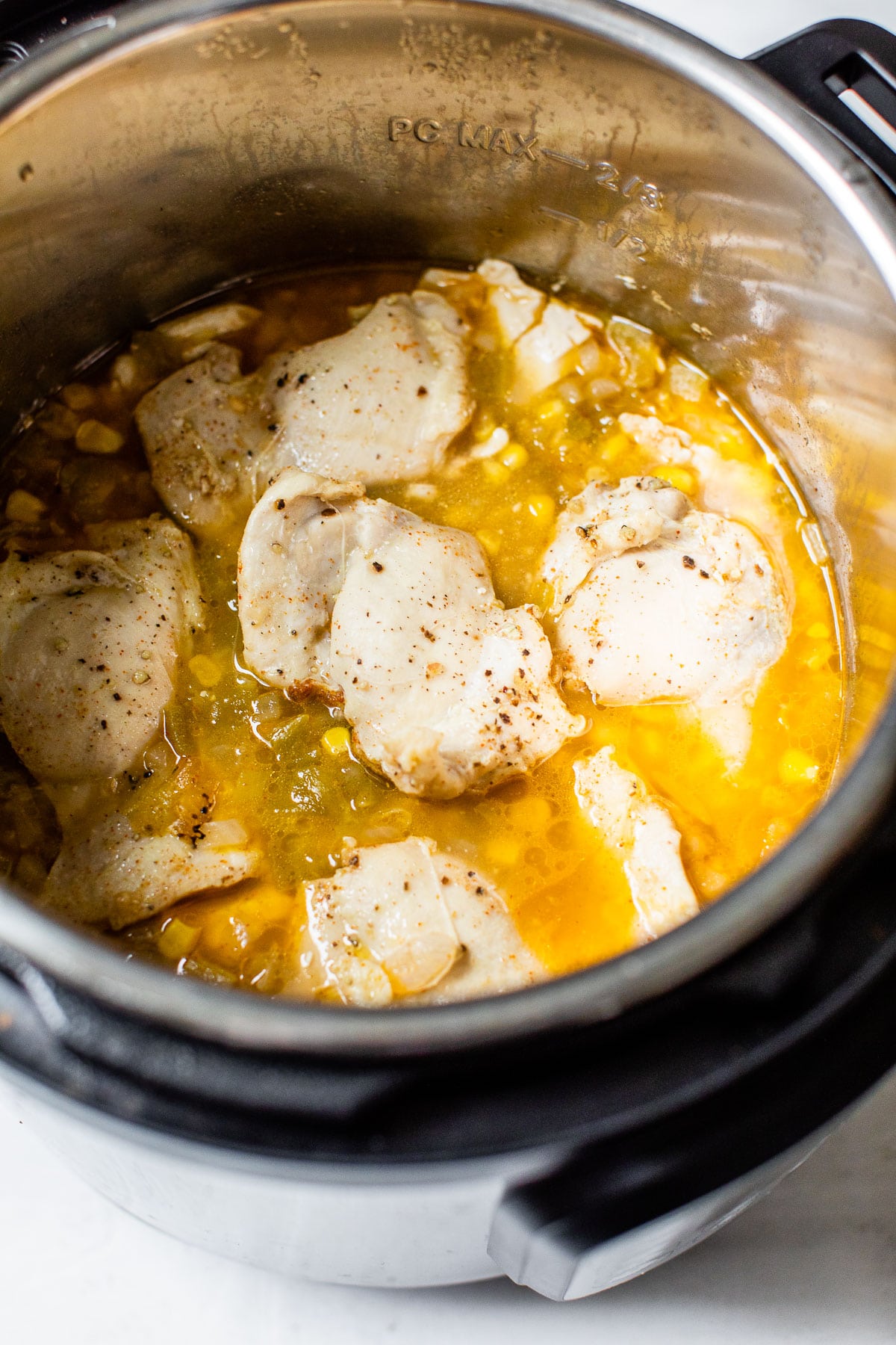 cooked chicken in broth in a pressure cooker