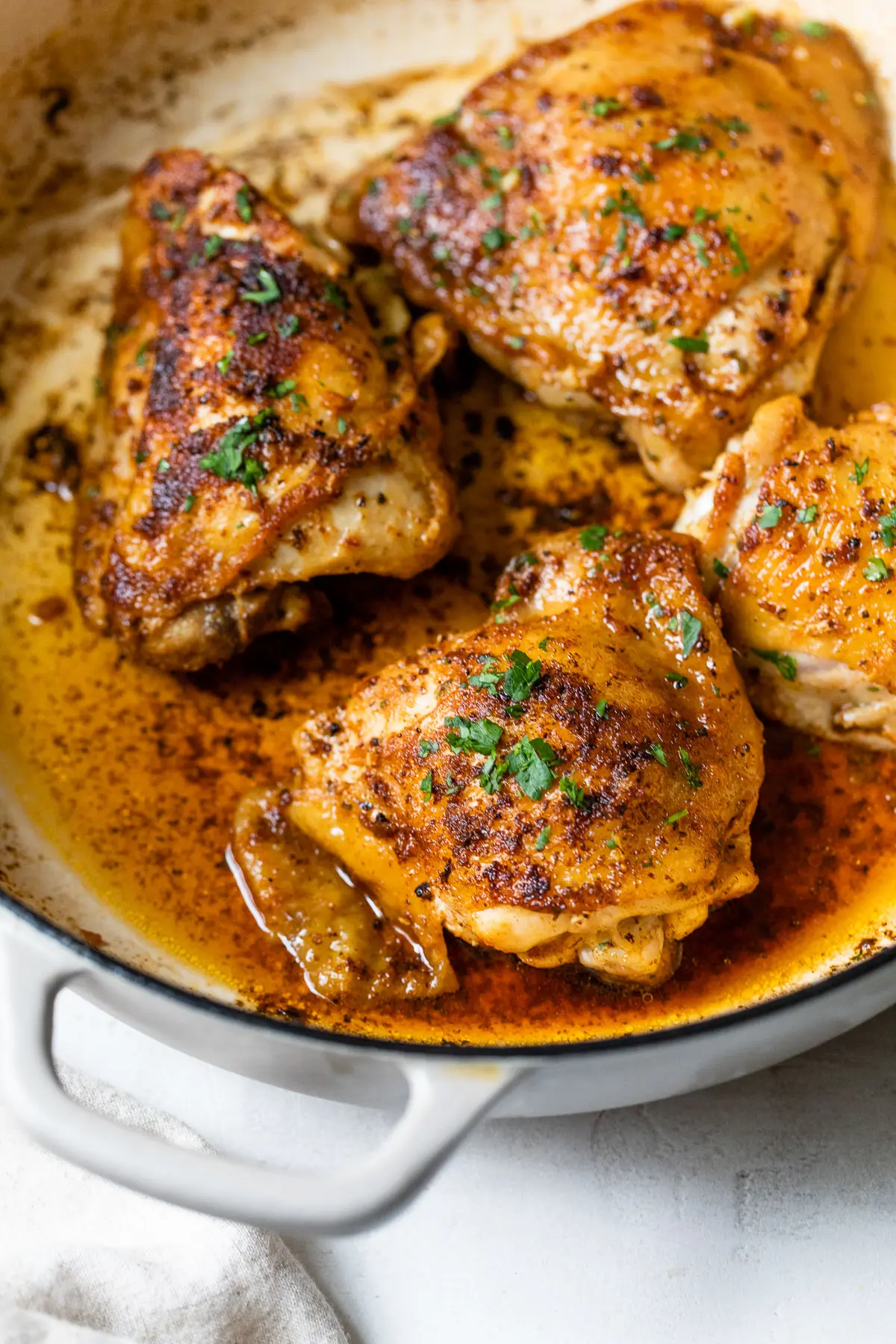 cooked chicken thighs in a large skillet