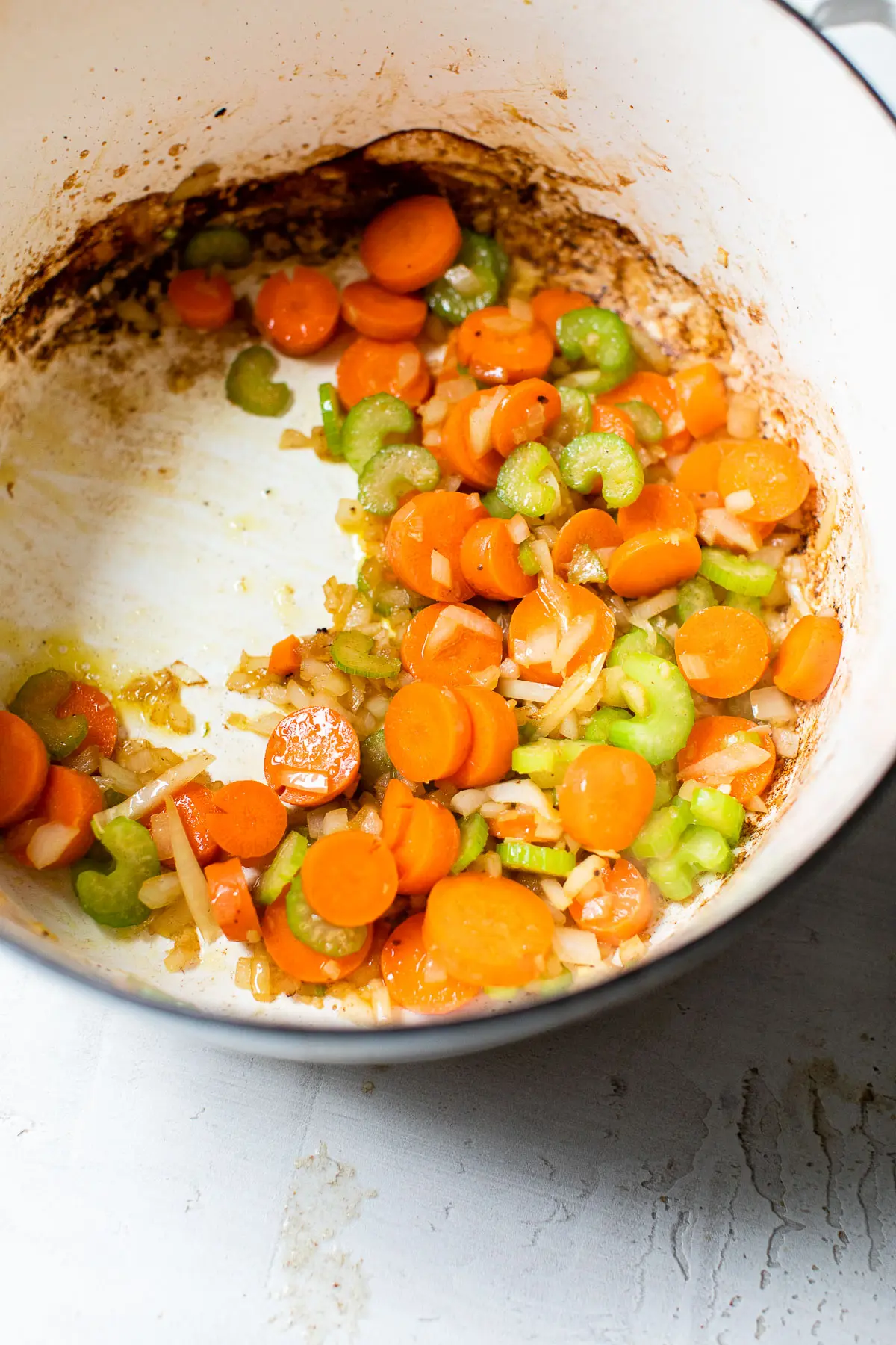cooked diced carrots, celery and onion in a dutch oven