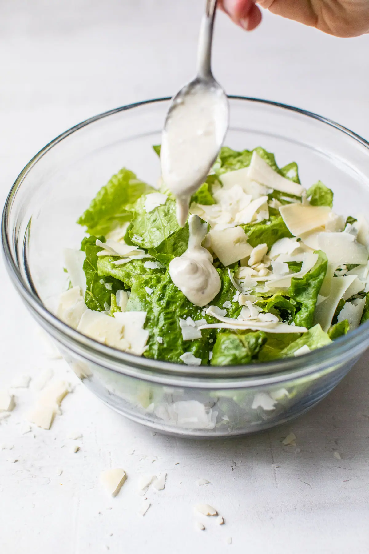 bowl of romaine lettuce drizzled with homemade dressing