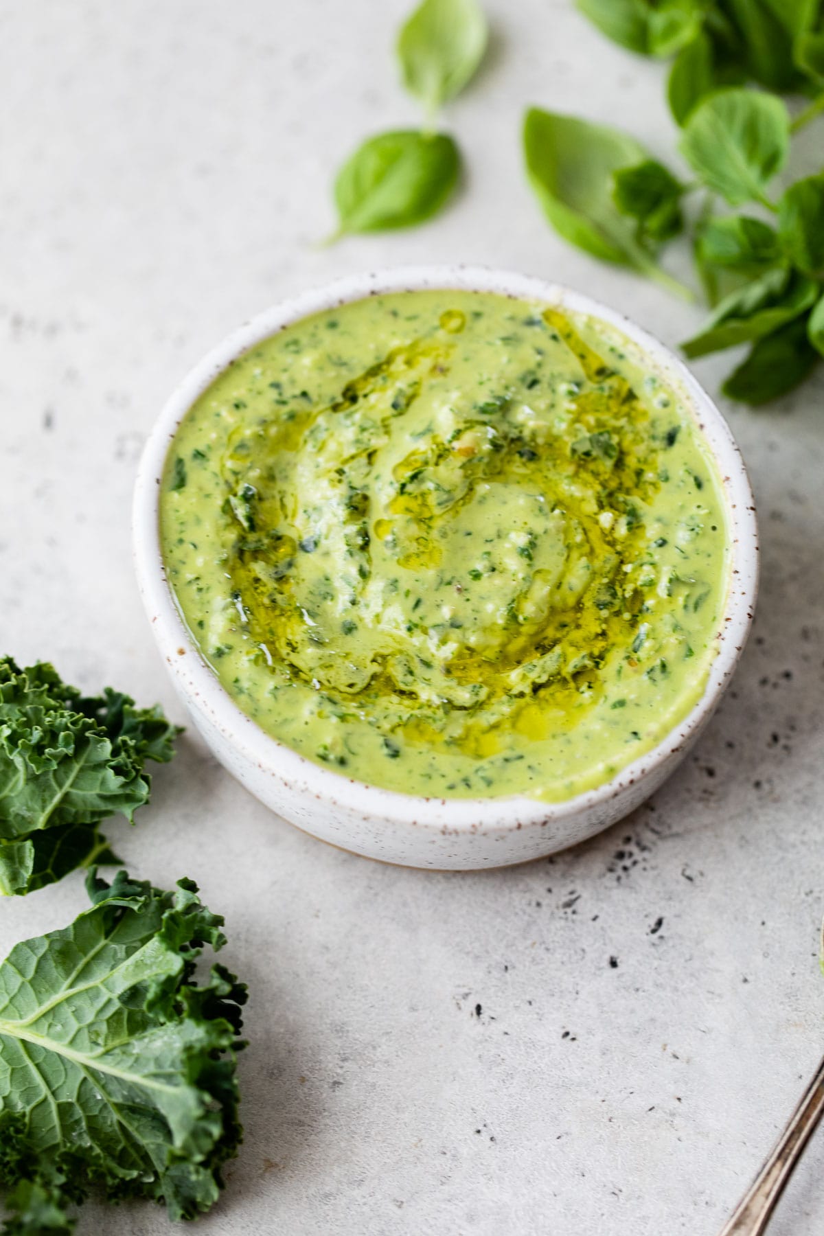 bowl of pesto drizzled with olive oil