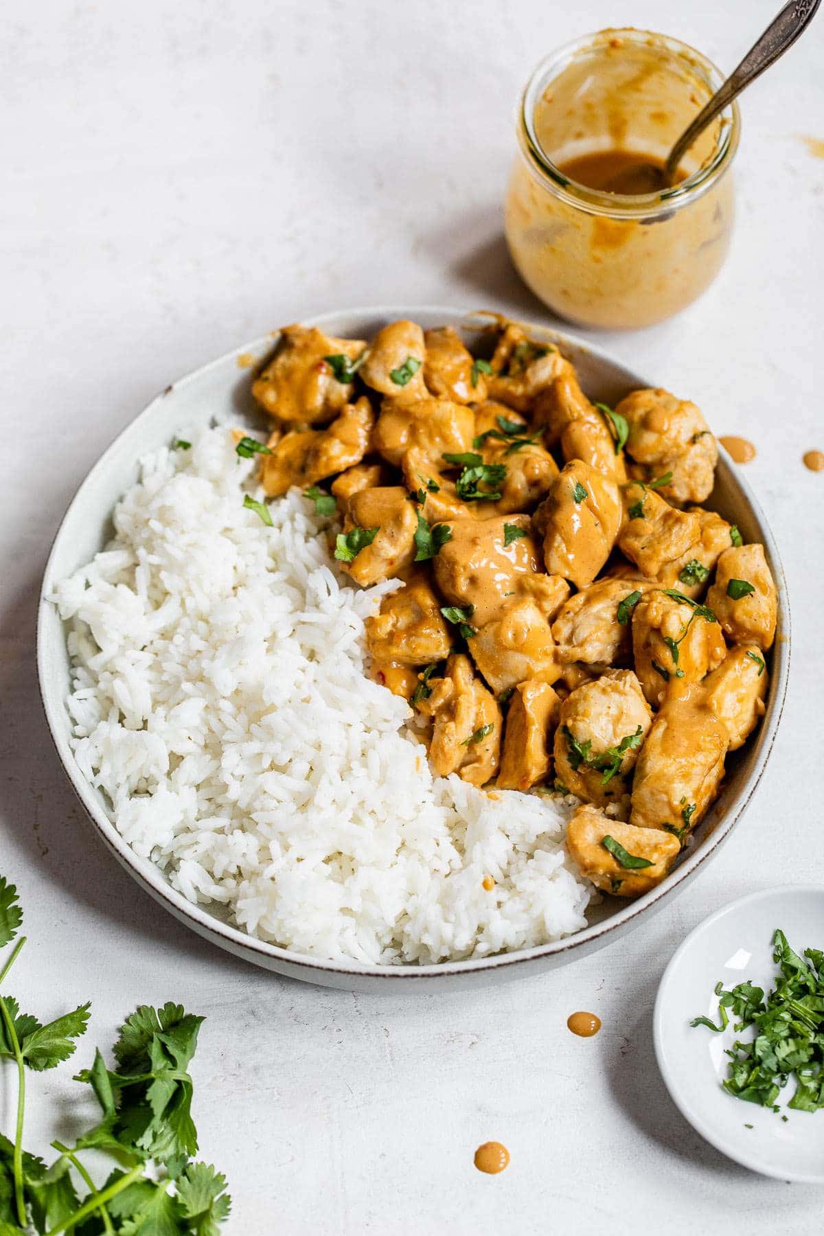 cooked chicken in a bowl with white rice
