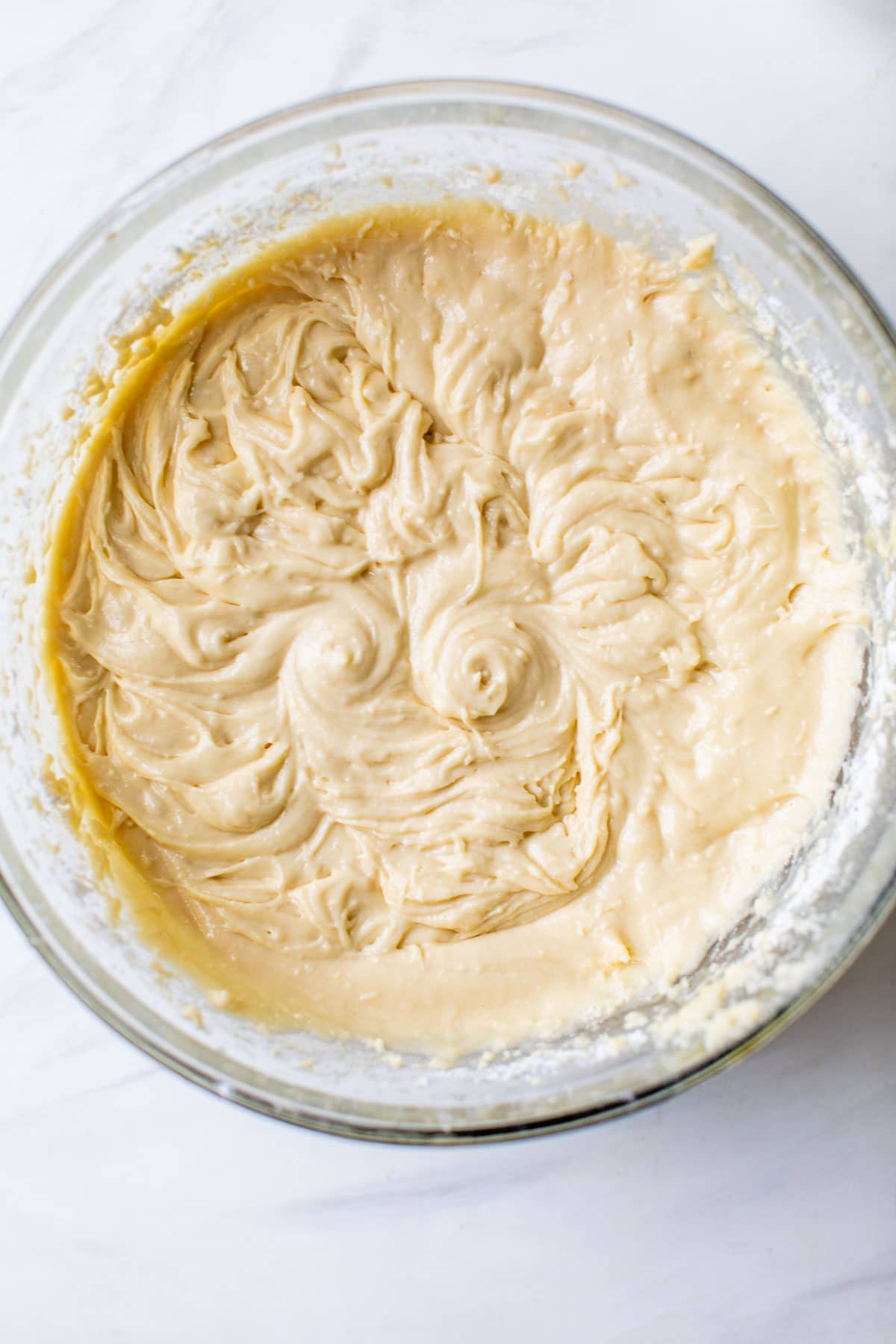 yellow cake batter in a large glass bowl