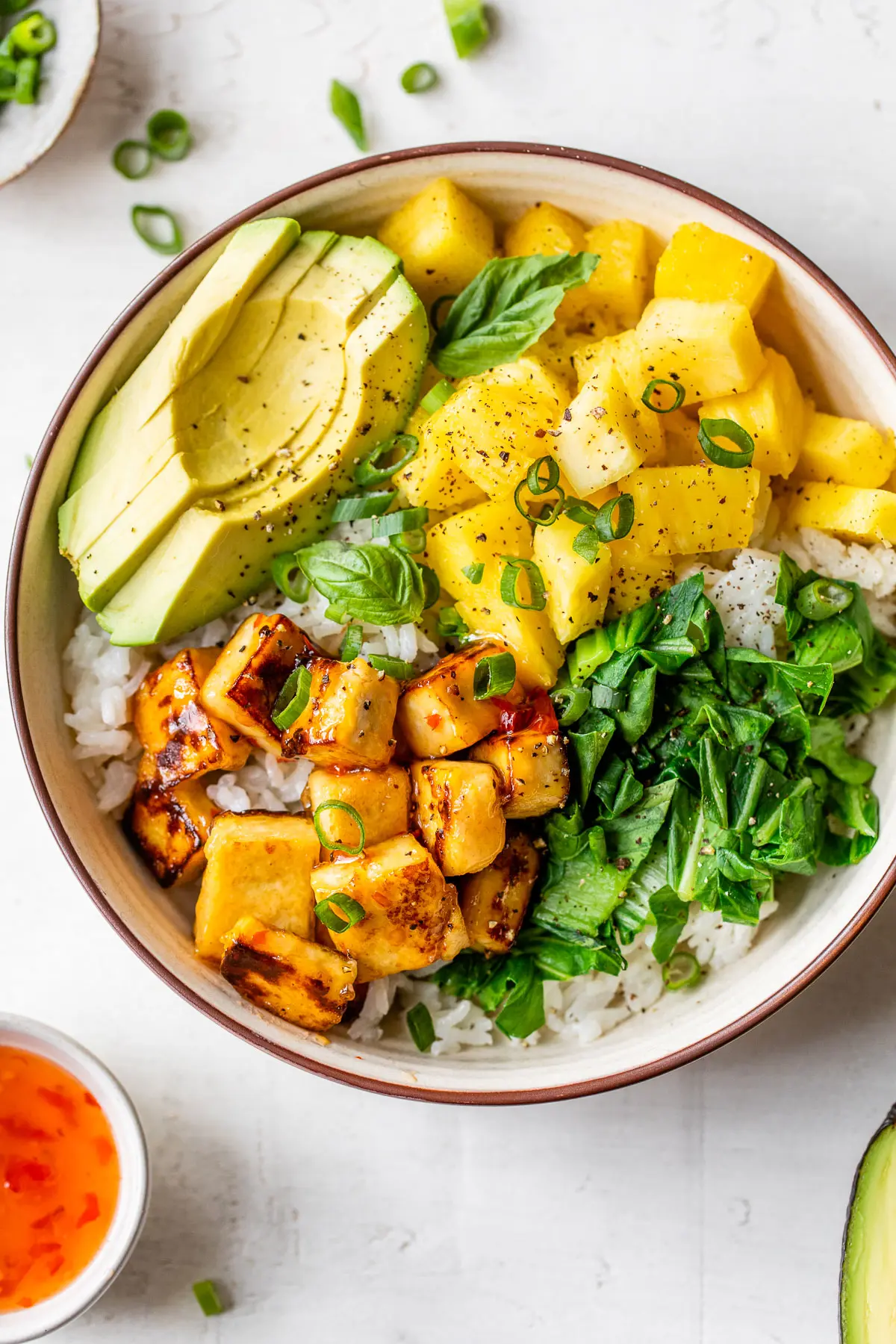 rice bowl with diced pineapple, avocado and diced tofu