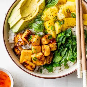 bowl with white rice, tofu, pineapple, and avocado