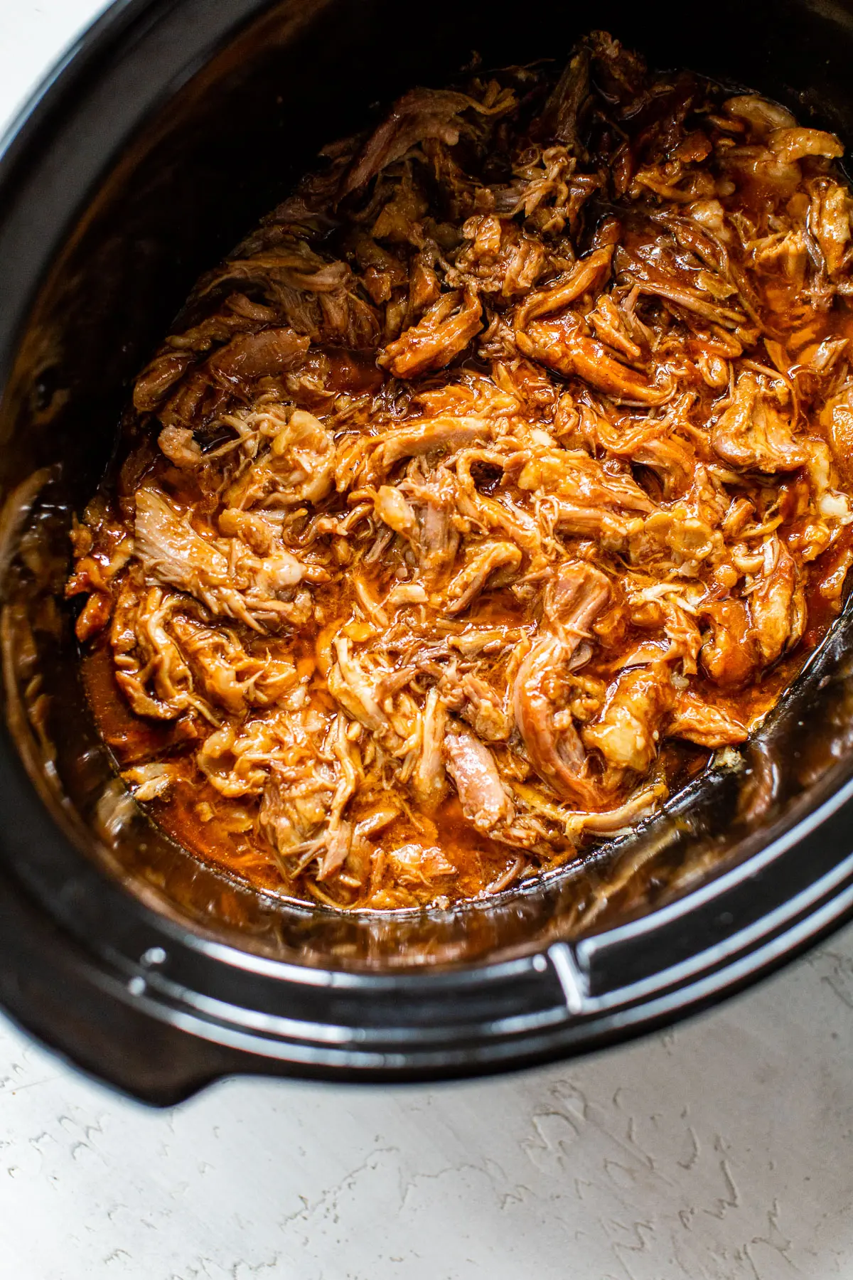 barbecue shredded pork in a slow cooker