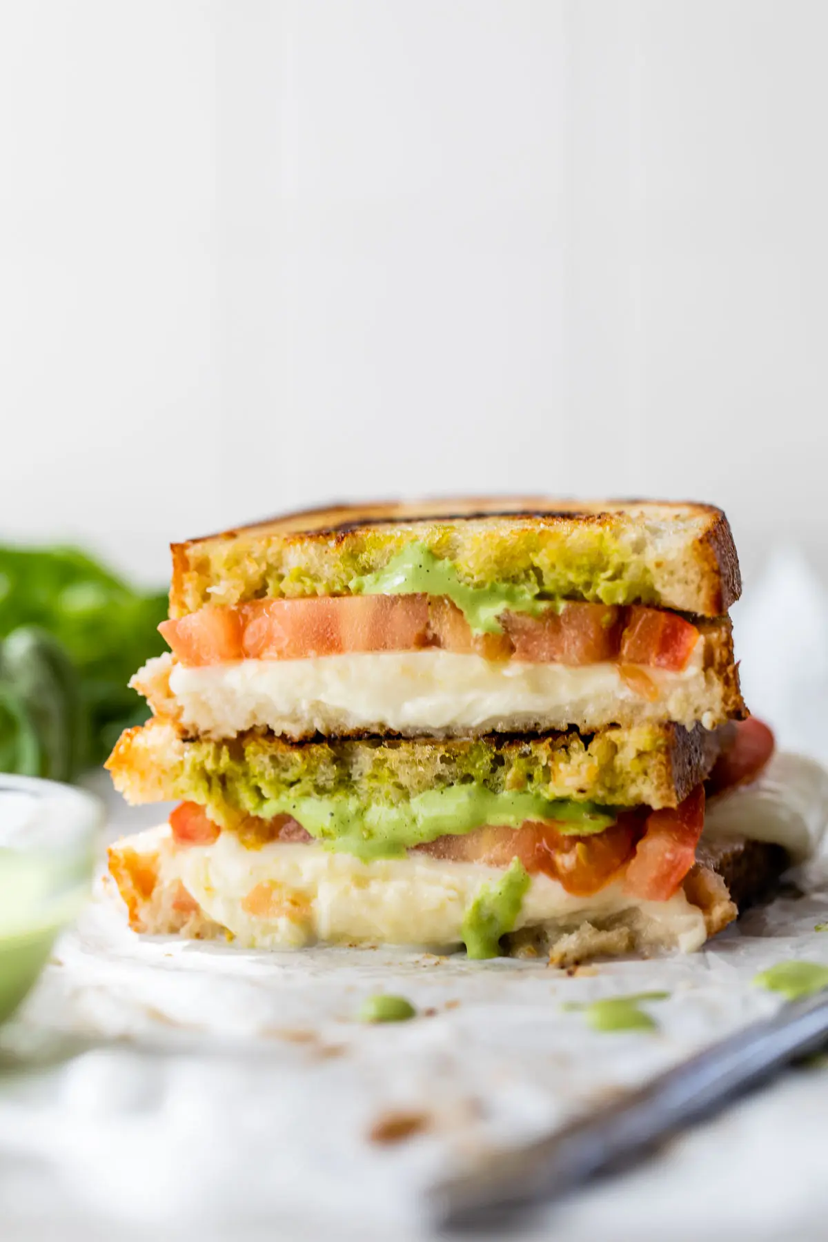 stacked grilled cheese with tomato and mayo