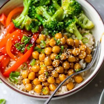 bowl filled with rice, broccoli, red bell pepper, and marinated chickpeas